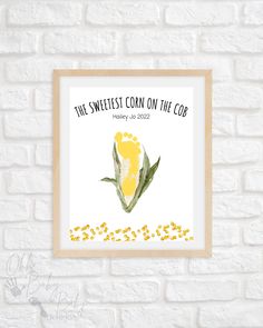 the sweetest corn on the cob is displayed in front of a brick wall