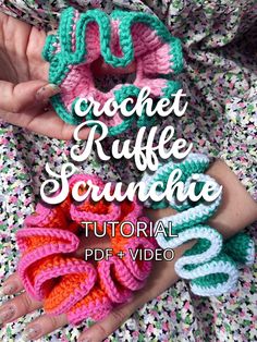 the crochet ruffle scrunchie is being held by someone's hands