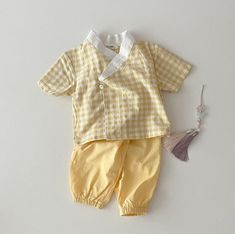 ♡ Gender neutral ♡ Recommended for 0-6 month babies. ♡ 2-piece set! Set includes jeogori and pants. ♡ Versatile, mix and match with other pieces. ♡ 100% Cotton ♡ Made in Korea  ♡ Perfect for daily wear.  The hanbok is typically worn for "dol" or "dol-janchi" which is the baby's first birthday.  Dol-janchi is a celebration to bless the child with a prosperous future and a long and healthy life.  Our hanbok is more casual than the typical dol-janchi hanbok and can be worn on an everyday basis for any occasion! Matching Short Sleeve Sets For Spring, White Matching Sets For Spring, Cotton Short Sleeve Pant Set, Cotton Short Sleeve Matching Pant Set, Spring Matching White Sets, Matching Spring Playwear Sets, Yellow Cotton Matching Set, Korean 1st Birthday Doljabi, Dohl Korean First Birthdays Boy