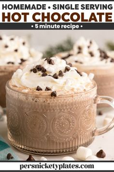 two mugs filled with hot chocolate and whipped cream