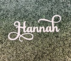 the word hannah written in cursive writing on a green and black background