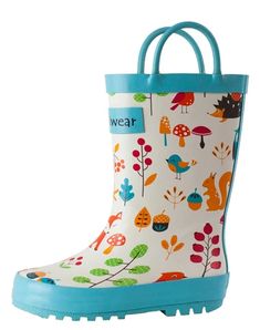 a child's rain boot with colorful trees and leaves on it, blue rubber outs