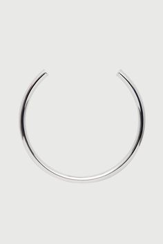 Made in Brazil, this tube choker’s sleek design is sculpted from sterling silver – simple enough for everyday and special enough for nights out and occasion. The perfect weight for solo wear or stacking, layer as desired for a modular effect. Jewelry Collection Handcrafted in Brazil Sterling Silver over Brass Thickness: 8.3mm Inner Diameter: 5" Opening: 3.25" Weight: 0.90 oz Waterproof Hypoallergenic Modern Silver Choker For Everyday, Minimalist Silver Hoop Necklace, Minimalist Sterling Silver Choker For Everyday, Minimalist Silver Choker For Everyday, Modern Silver Everyday Choker, Modern Silver Chain Choker, Everyday Minimalist Sterling Silver Choker, Everyday Minimalist Silver Choker, Minimalist Stainless Steel Choker