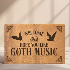 a welcome mat that says,'welcome hope you like goth music'on it