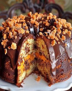 a cake with chocolate frosting and nuts on top