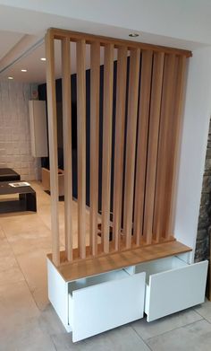 a wooden bench sitting in the middle of a living room