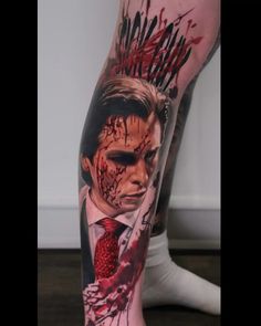 a man's leg covered in blood and makeup