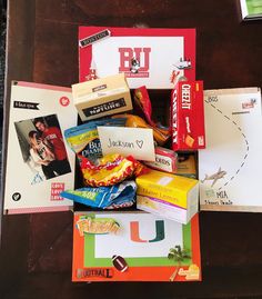 an assortment of snacks and candy on a table top with the letter u next to it