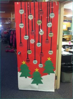 a door decorated to look like christmas trees and snowflakes with words on them