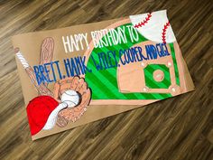 a baseball themed birthday card on the floor