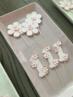 pink and white cupcake toppers with flowers on them