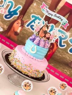 a birthday cake with horse decorations on it