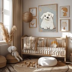 a baby's room with pictures on the wall