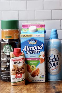 the ingredients for an almond milk smoothie are displayed on a counter