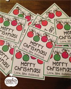 four christmas cards with the words merry christmas and six red, green and white ornaments