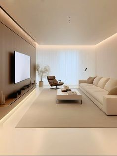 a living room with white furniture and a flat screen tv mounted on the wall above it