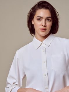 Chic White Blouse With Roll-up Sleeves, Classic Fall Blouse With 3/4 Sleeves, Classic 3/4 Sleeve Fall Blouse, Classic 3/4 Sleeve Blouse For Fall, Classic Blouse With 3/4 Sleeves For Fall, Classic Blouse With Roll-up Sleeves And Shirttail Hem, White Blouse With Hidden Button Closure For Work, Versatile White Blouse With Button Closure, White Versatile Blouse With Button Closure