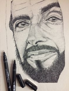 a pencil drawing of a man's face with three different pens next to it