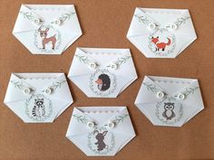 six white envelopes with animals on them