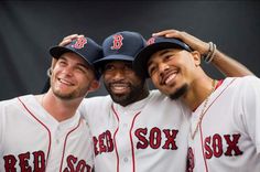 three baseball players are posing for a photo in their red sox uniforms on the field