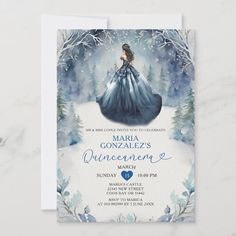 the princess in blue gown is standing on snow covered ground with trees and branches around her