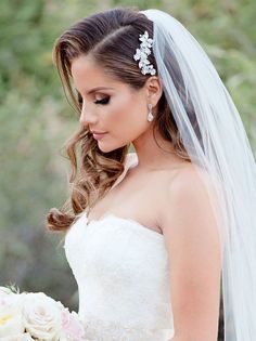 a woman in a wedding dress holding a bouquet