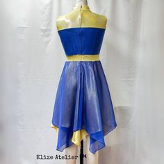 a blue and yellow dress on a mannequin