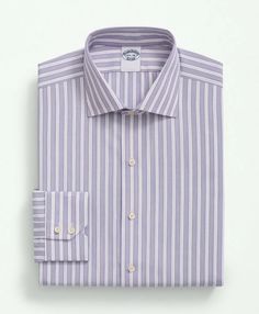 Meet our most luxurious dress shirts: fabrics woven in Italy by Thomas Mason®, the world-renowned English company crafting fine textiles with unwavering quality since 1796. Ultra-fine 120s count, 2-ply thread offers lightweight versatility with a soft, smooth handfeel. Highly considered details like pucker-free seams, and our signature 6-Pleat Shirring® at the cuffs round out the ideal dress shirt..Available in Fits:.REGULAR Our average fit across the chest, body and sleeves..English Spread Coll Classic Purple Cotton Dress Shirt, Elegant Purple Shirt For Business Casual, Classic Purple Dress Shirt For Work, Purple Cotton Formal Dress Shirt, Classic Purple Dress Shirt For Formal Occasions, Elegant Purple Dress Shirt For Business, Elegant Purple Business Shirt, English Collar, Luxurious Dress