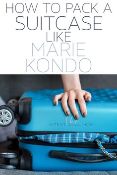 a woman's hand on top of a suitcase with the words how to pack a suitcase like marie kondo