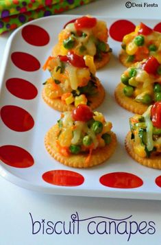 small appetizers are arranged on a plate with polka dot border around the edges