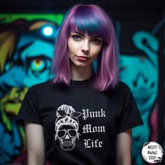 Unleash your inner goth and celebrate your love for the darkly whimsical with our Punk Mom Life Tshirt - a timeless canvas for your alternative style and a commitment to sustainability. Crafted with meticulous attention to detail, this shirt is not just a fashion statement; it's a reflection of your unique expression.   Key Features:   🖤 Gothic Elegance: This ultra cotton tee boasts a classic fit and medium fabric weight (6.0 oz/yd²)--the perfect match for all-season wear. Made from 100% US cotton, it ensures long-lasting comfort that effortlessly blends in with your goth, punk, or alternative wardrobe.   🖤 Versatile Dark Aesthetic: The classic fit and crew neckline provide a highly versatile choice, suitable for both casual and semi-formal occasions. Its clean, minimalist look complemen Black Cotton Tops In Pastel Goth Style, Stretch Punk T-shirt For Alternative Fashion, Emo T-shirt For Halloween, Emo Style Black T-shirt With Skull Print, Black Emo T-shirt, Punk Mom, Punk Halloween Text Print T-shirt, Punk Halloween T-shirt With Text Print, Dark Comfort