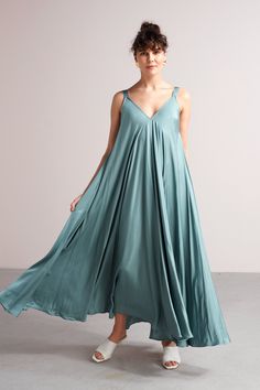 "MALIA dress. ✦ SURPRISING. MYSTICAL. FREE. ✦ Don't mind us, we're just fluttering by to let you know that this maxi dress would look so amazing on you! It features a lovely relaxed fit that looks amazing on any body type. It will be your number one for any special occasion. * Tailoring time - 3 weeks * ✅ SIZE & FIT Model is 173 cm/5'7 and wears ONE SIZE dress. Full length - 142 cm / 55,9\". Please note that all garment measurements might have slight variations due to the handmade nature of Blue Sleeveless Slip Dress For Beach, Light Blue Flowy Sleeveless Maxi Dress, Flowy Light Blue Sleeveless Maxi Dress, Light Blue Sleeveless Slip Dress For Summer, Blue Sundress For Casual Occasions, Light Blue Flowy Sleeveless Sundress, Blue Sleeveless Sundress Slip Dress, Blue Sleeveless Sundress Slip, Light Blue Maxi Sundress