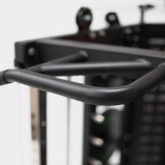 a close up view of the handles and bars on a gym equipment rack in a gym