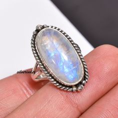 925 Sterling Silver Moonstone Bohemian Handmade Ring, Moonstone Jewelry, Oval Three Bnad Ring, Women Ring, Moon Ring, Rainbow Gift For Her            Moonstone is thought to provide protection to those who travel when the moon is shining . It may enhance intuition and promote inspiration. Moonstone also assists in the acceptance of love. ------------------------------------------------------------------------------------------------------------------------------------ All my Designs are original with 925 Sterling Silver  Size - All Size Ring Stone Name- Rainbow Moonstone Stone Shape- Oval Setting - Bezel Visit For more:-  https://www.etsy.com/in-en/shop/silverindex https://www.etsy.com/in-en/shop/silverindex?ref=seller-platform-mcnav My Spinner Section:- https://etsy.me/3kpiibx My Spinner Bohemian Oval Cabochon Moonstone Ring, Handmade Bohemian Oval Moonstone Ring, Bohemian White Oval Crystal Ring, Bohemian Silver Moonstone Ring In Oval Cabochon, Bohemian Sterling Silver Oval Cabochon Moonstone Ring, Bohemian Silver Moonstone Cabochon Ring, Bohemian Silver Oval Cabochon Moonstone Ring, Bohemian Silver Moonstone Ring With Oval Cabochon, Oval Moonstone Crystal Ring Stamped 925