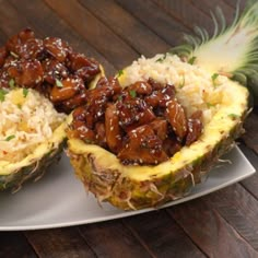 two pineapples with meat and rice in them