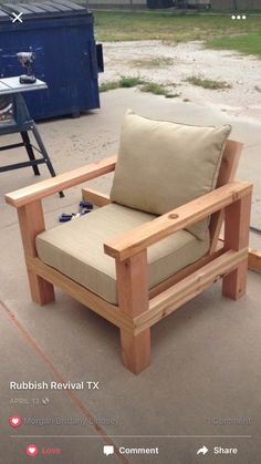 a wooden chair sitting on top of a cement ground