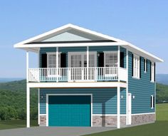 a blue and white two story house with balconies