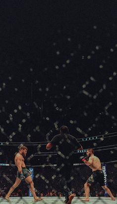 two men in the middle of a wrestling match