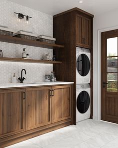 a washer and dryer sitting in a kitchen next to wooden cabinets with open doors