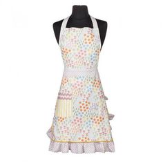 an apron on a mannequin with polka dot print and ruffled hems