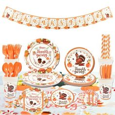 an orange thanksgiving themed table setting with turkey plates, forks and paper straws on it