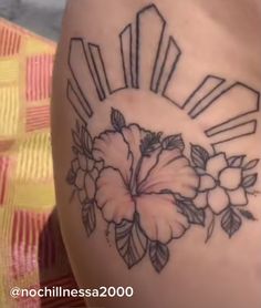 a woman's thigh with flowers on it