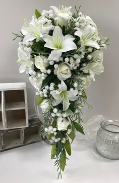 a bouquet of white flowers on a table