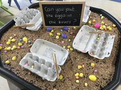 an egg carton filled with eggs and some writing on the side that says can you put the eggs in the boxes?