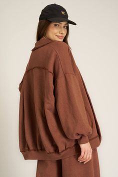 Meet your new go-to for effortless edge.The Nigel Slouchy Jacket is crafted from a soft to the touch French terry and features bold big pockets with raw-edged seams for a rugged touch. With its relaxed, oversized fit and subtle bubble sleeves, it’s designed for laid-back style that still makes a statement. Pair it with the Nigel Pleated Wide Leg Pant to complete the look. 61% Cotton39% Polyester Care Instructions: Machine wash cold. Wash inside out with similar colors. Do not bleach. Lay flat to Oversized Soft Outerwear For Layering, Comfy Oversized Outerwear With Soft Texture, Oversized Outerwear With Soft Texture For Loungewear, Oversized Winter Outerwear With Frayed Hem, Oversized Outerwear With Frayed Hem For Winter, Fall Relaxed Fit Outerwear With Soft Texture, Oversized Outerwear For Fall Loungewear, Comfy Relaxed Fit Outerwear With Pockets, Oversized Solid Outerwear With Soft Texture