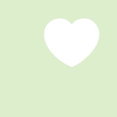 a white heart on a green background