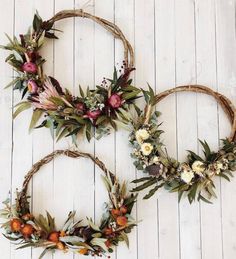 two wreaths made out of branches and flowers