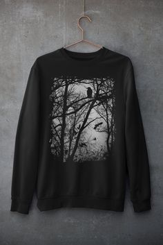 Check Out this new sweatshirt for the colder months. Percfect as a Christmas Gif or B day gift. Unisex Outfit with Goth Vibes We are giving away $20 on a $100 order,  or simply,  a 20% COUPON CODE ONLY TO OUR ETERNAL CUSTOMERS! Remember to join our mailing list to get this and future new discounts code!  www.eternitylinedesign.com TECHNICAL DATA: * 50% cotton, 50% polyester * Classic fit * 1x1 athletic rib knit collar with spandex * Air-jet spun yarn with a soft feel and reduced pilling * Double-needle stitched collar, shoulders, armholes, cuffs, and hem ⚠️⚠️⚠️ Machine wash cold, inside-out, gentle cycle with mild detergent and similar colors. Use non-chlorine bleach, only when necessary. No fabric softeners. Tumble dry low, or hang-dry for longest life. Cool iron inside-out if necessary. Fall Crew Neck Top With Graphic Design, Grunge Tops With Screen Print For Winter, Winter Crew Neck T-shirt With Graphic Design, Black Graphic Sweatshirt For Fall, Black Screen Print Sweatshirt For Fall, Fall Black Sweatshirt With Screen Print, Flying Crows, Emo Style, Dark Design