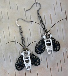 We present our silver moth zipper earrings. Nickel zipper pulls form the body for these little guys, while oxidized brass filigree serves as the Hardware Jewelry Diy, Zipper Earrings, Gothic Moth, Goth Moth, Steampunk Choker, Steampunk Owl, Zipper Bracelet, Steampunk Bracelet, Zipper Jewelry