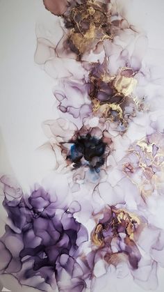 an abstract painting with purple and gold flowers on white paper in the middle of it